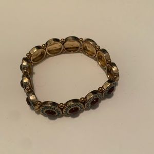 Gold bracelet with turquoise and purple stones